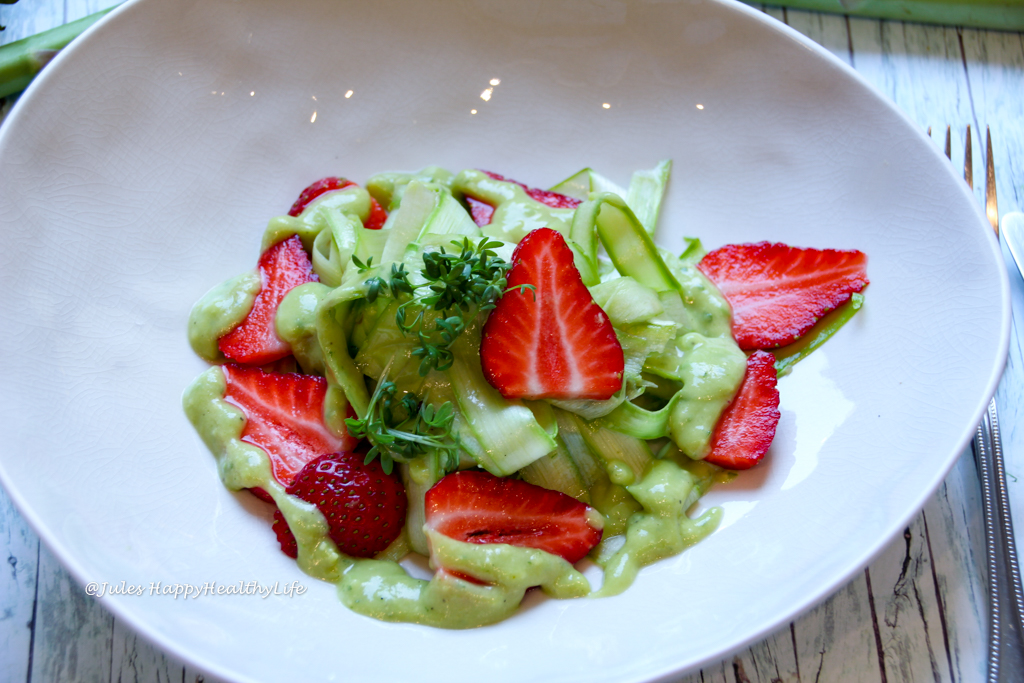 perfect spring recipe for vegan raw asparagus salad with avocado dressing and strawberries